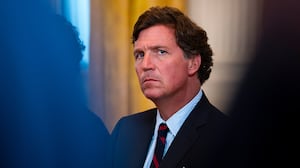 Tucker Carlson sitting down