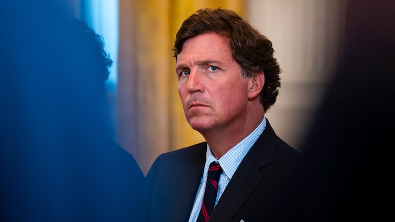 Tucker Carlson sitting down