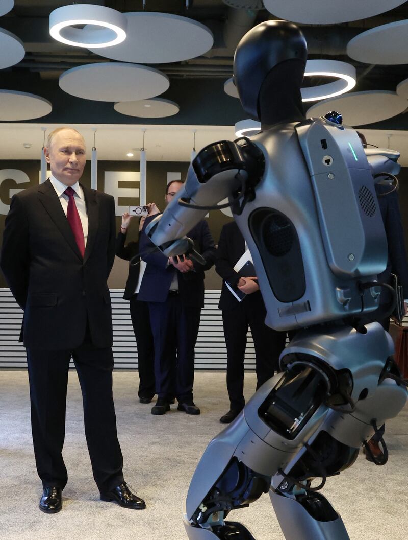 In this pool photograph distributed by the Russian state agency Sputnik, Russia's President Vladimir Putin visits an exhibition of the AI Journey international AI (Artificial intelligence) conference in Moscow on November 19, 2025. Russia's anthropomorphic AI-equipped robot developed by technology company Sber was presented to the Russian leader. (Photo by Vyacheslav PROKOFYEV / POOL / AFP) (Photo by VYACHESLAV PROKOFYEV/POOL/AFP via Getty Images)