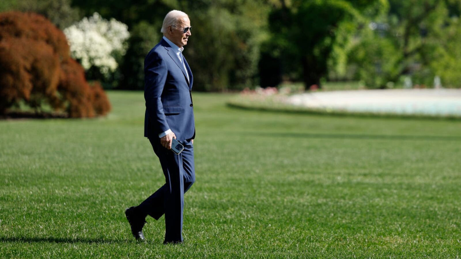 Joe Biden has stopped walking alone across the South Lawn at the White House to board Marine One.