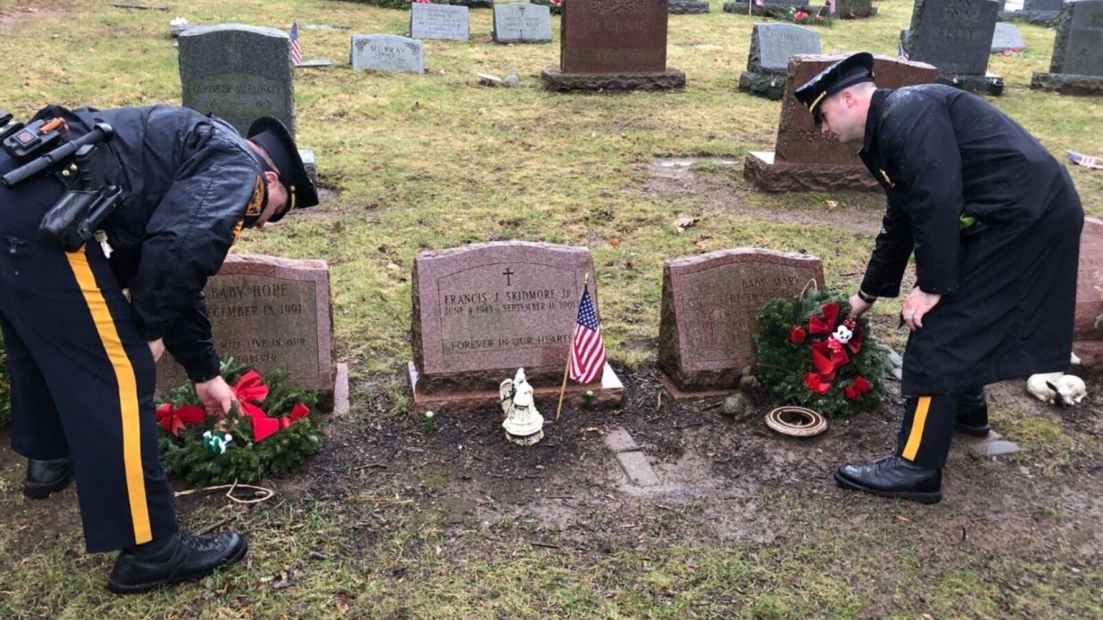 Police stand at the grave of 'Baby Mary'.