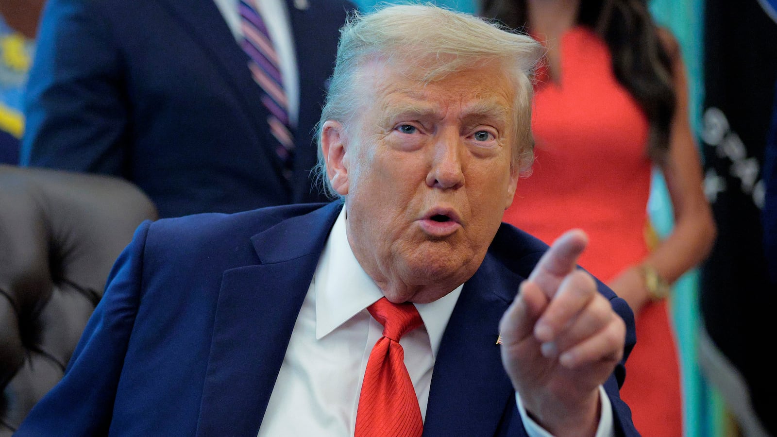 President Donald Trump talks to journalists after signing executive orders in the Oval Office at the White House on August 25, 2025 in Washington, DC.