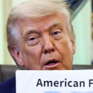 U.S. President Donald Trump holds a reflecting pool image at the Oval Office of the White House, in Washington, D.C., June 3, 2026.