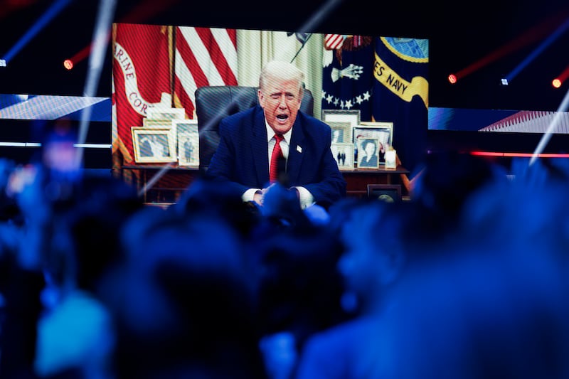 A video message from President Donald Trump is played on the final day of Turning Point USA's annual AmericaFest conference at the Phoenix Convention Center on December 21, 2025 in Phoenix, Arizona.