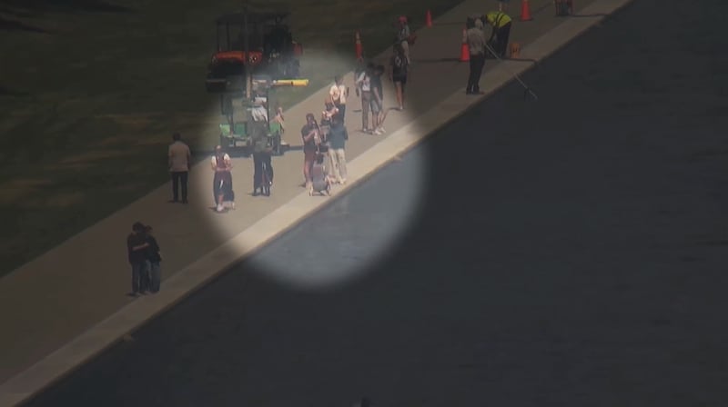 The US Park Police are looking for a woman seen reaching into the reflecting pool.