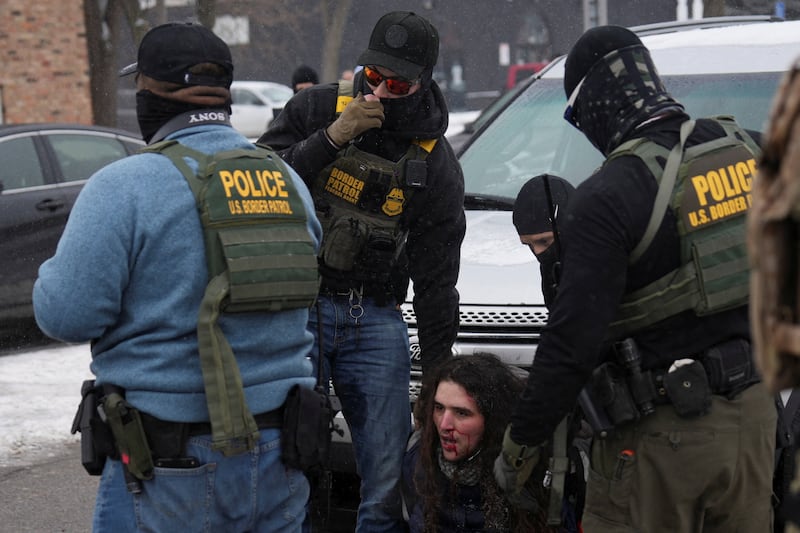 Federal agents detain a resident as immigration enforcement continues after a U.S. Immigration and Customs Enforcement (ICE) agent fatally shot Renee Nicole Good on January 7 during an immigration raid, in Minneapolis, Minnesota, U.S., January 21, 2026.