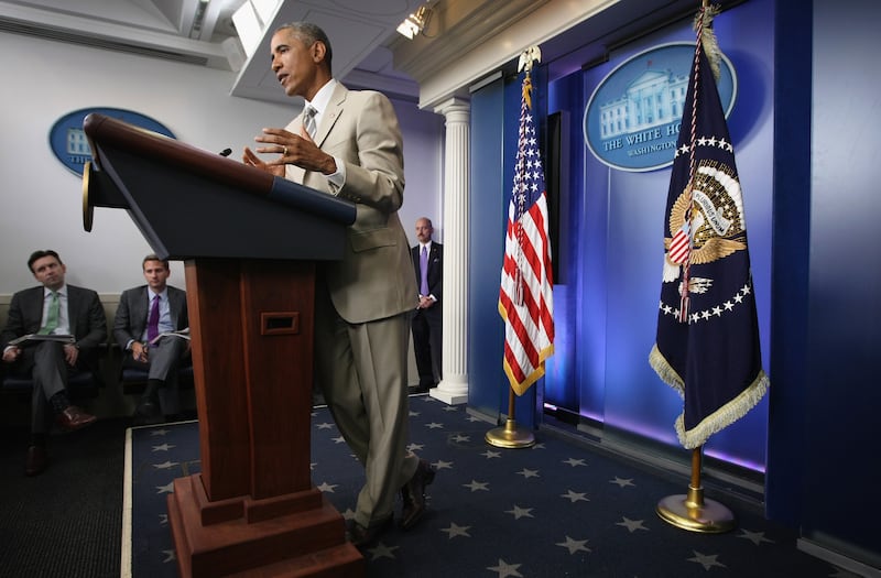President Barack Obama in a tan suit during a press conference in August 2014.