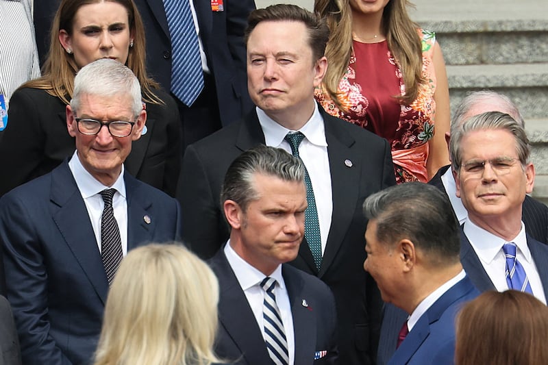Apple CEO Tim Cook, Tesla CEO Elon Musk, U.S. Defense Secretary Pete Hegseth and U.S. Treasury Secretary Scott Bessent attend the welcome ceremony for U.S. President Donald Trump by Chinese President Xi Jinping, at the Great Hall of the People in Beijing, China May 14, 2026.