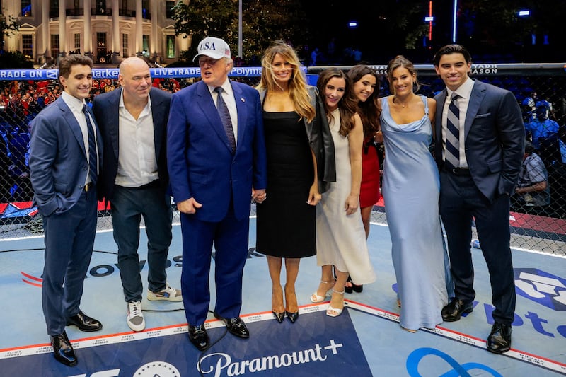 U.S. President Donald Trump, first lady Melania Trump, UFC CEO Dana White and other guests pose inside the Octagon at UFC Freedom 250 on the South Lawn of the White House in Washington, D.C., U.S., June 15, 2026. REUTERS/Evan Vucci/Pool