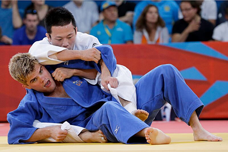 galleries/2012/08/08/doping-racist-tweets-and-throwing-games-olympics-hall-of-shame-photos/nick-delpopolo-olympic-hall-of-shame_mxwtrf