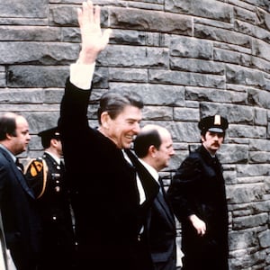 This photo taken by presidential photographer Mike Evens on March 30, 1981 shows President Ronald Reagan waving to the crowd just before the assassination attempt on him outside the Hilton Hotel in Washington, D.C.