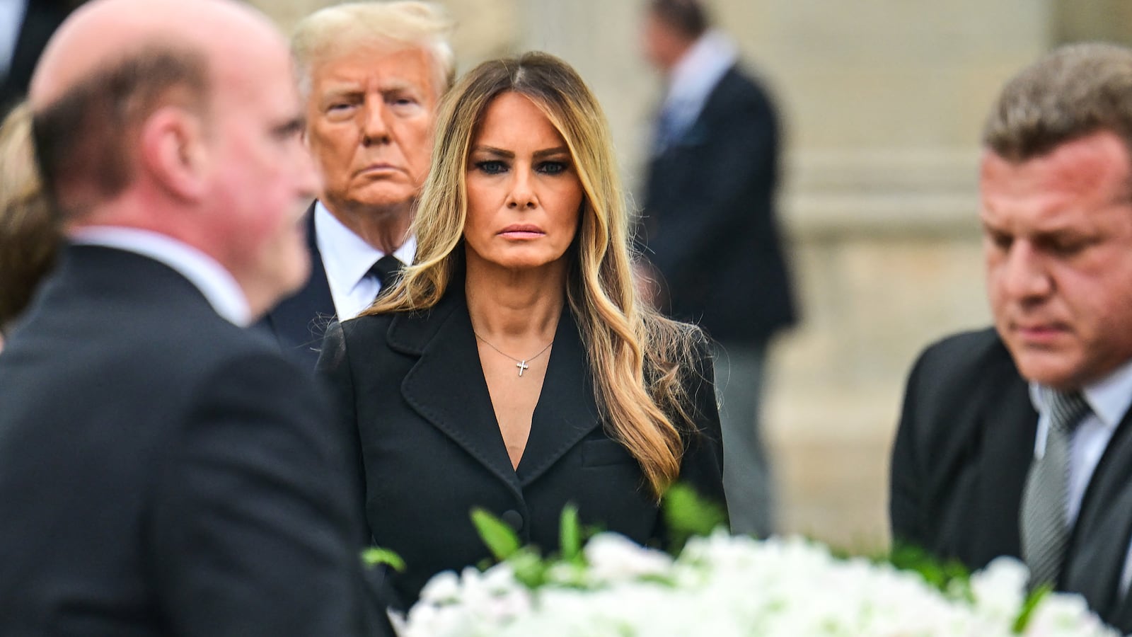 Former US First Lady Melania Trump (C), with her husband former US President Donald Trump (rear), leaves the funeral service for her mother, Amalija Knavs, at the Church of Bethesda-by-the-Sea in Palm Beach, Florida, on January 18, 2024.