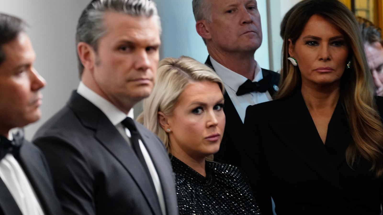 Secretary of State Marco Rubio, U.S. Secretary of War Pete Hegseth, White House Press Secretary Karoline Leavitt, and First Lady Melania Trump listen as U.S. President Donald Trump speaks during a press conference in the Brady Briefing Room of the White House on April 25, 2026 in Washington, DC. President Trump is making a statement after the cancelation of the annual White House Correspondents Association Dinner after a possible shooting.