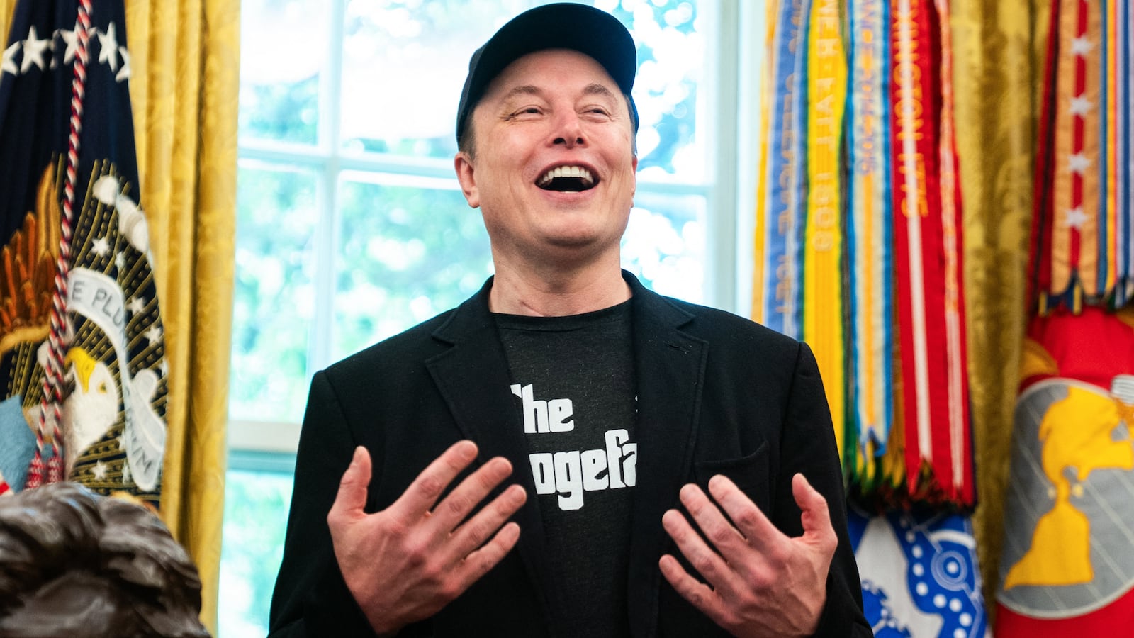 Elon Musk speaks during a news conference with US President Donald Trump