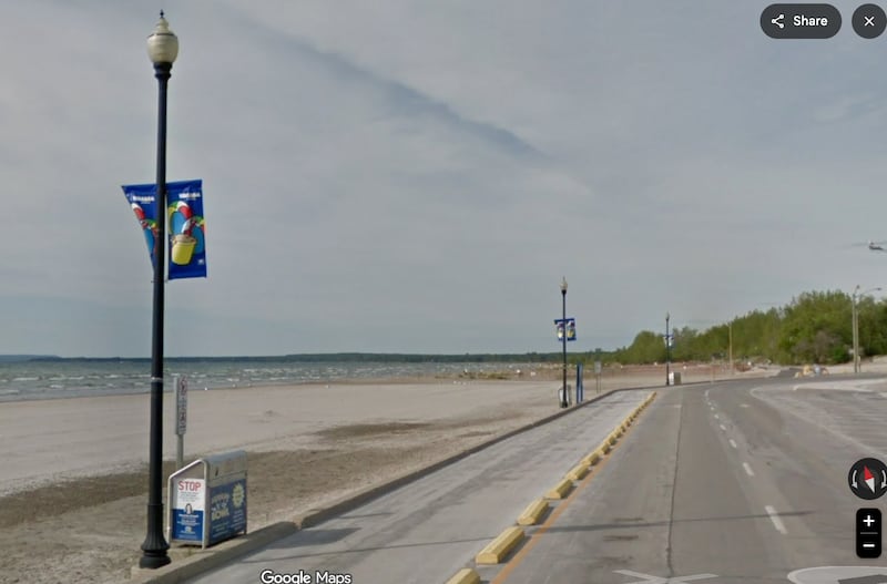 A beach and a road beside it.
