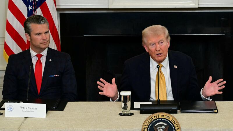 US President Donald Trump, flanked by Defense Secretary Pete Hegseth (L) and Attorney General Pam Bondi