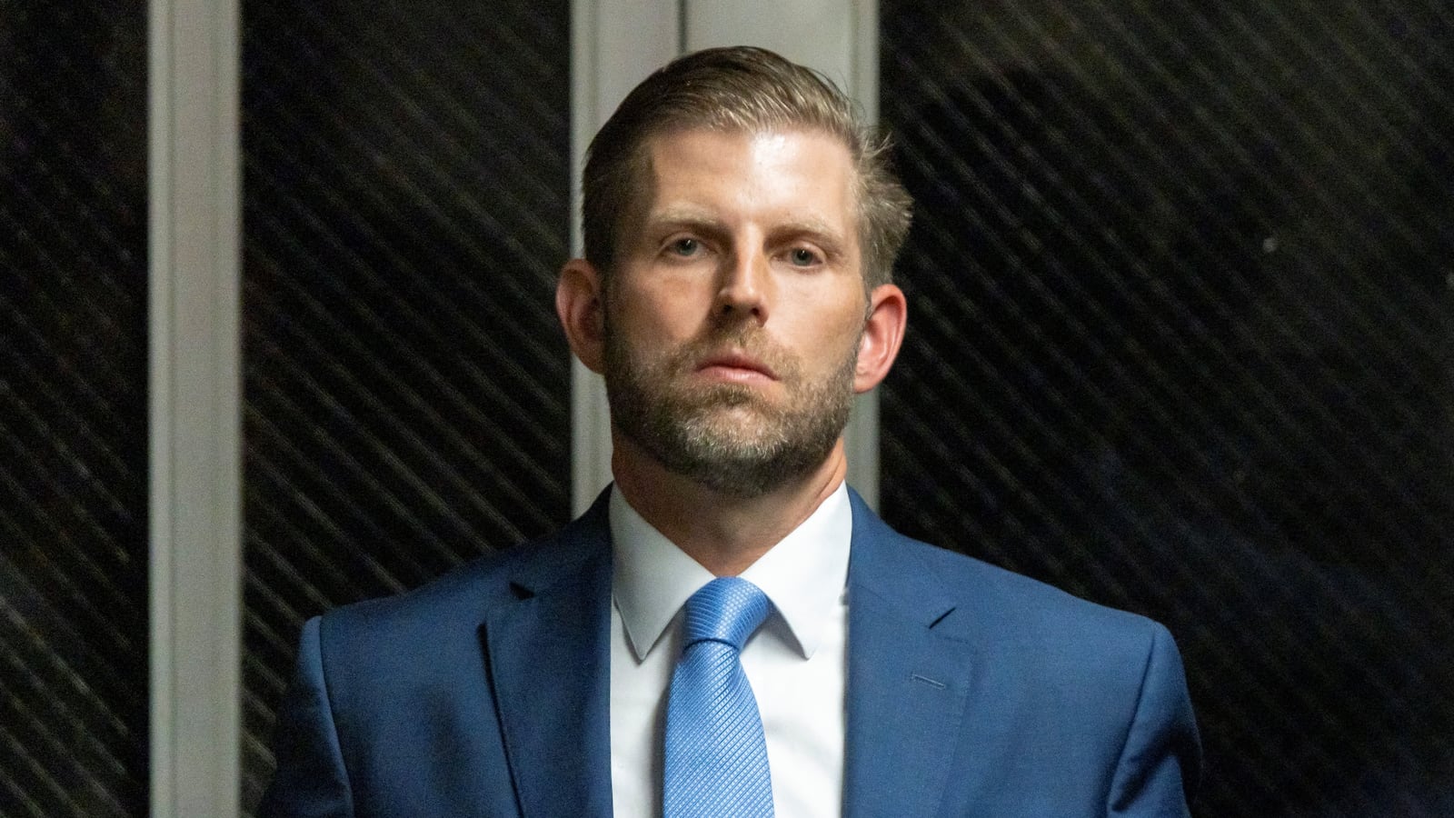 Eric Trump walks out of a New York City courthouse.