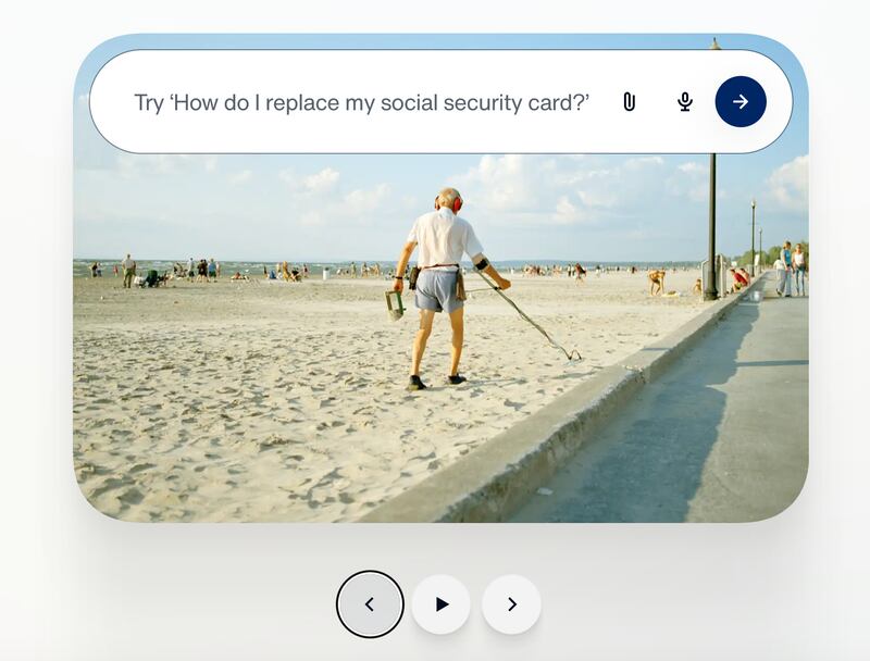 A man using a metal detector on a beach