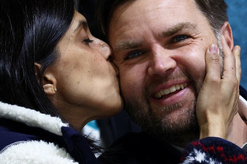 Milano Cortina 2026 Olympics - Ice Hockey - Women's Preliminary Round - Group A - United States of America vs Czech Republic - Milano Rho Ice Hockey Arena, Milan, Italy - February 05, 2026. Second lady Usha Vance kisses U.S. Vice President and husband JD Vance during the match REUTERS/Guglielmo Mangiapane     TPX IMAGES OF THE DAY