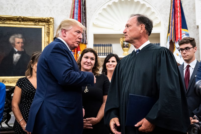 President Donald J. Trump greets Associate Justice of the Supreme Court Samuel Alito as he departs from a ceremony to swear in Secretary of Defense Mark Esper in the Oval Office at the White House on Tuesday, July 23, 2019 in Washington, DC.