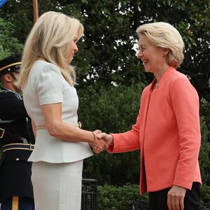 European Commission President Ursula von der Leyen is greeted by U.S. Chief of Protocol Monica Crowley as she arrives at the White House for a meeting with President Donald Trump and Ukrainian President Volodymyr Zelensky on August 18, 2025.