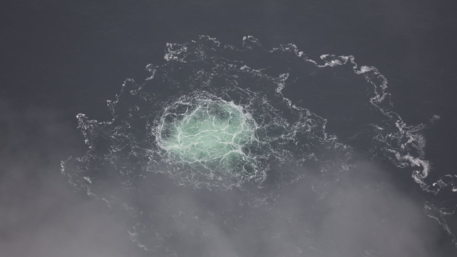 In this Handout Photo provided by Swedish Coast Guard, the release of gas emanating from a leak on the Nord Stream 2 gas pipeline in the Baltic Sea on September 28, 2022 in At Sea.