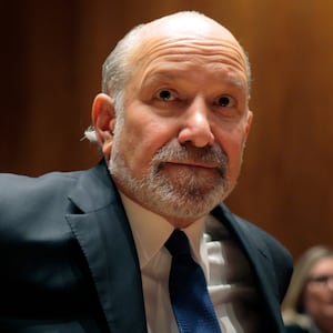 Commerce Secretary Howard Lutnick arrives to testify during a Senate subcommittee as he faces bipartisan calls to resign after new revelations came to light in the latest release of Epstein files.