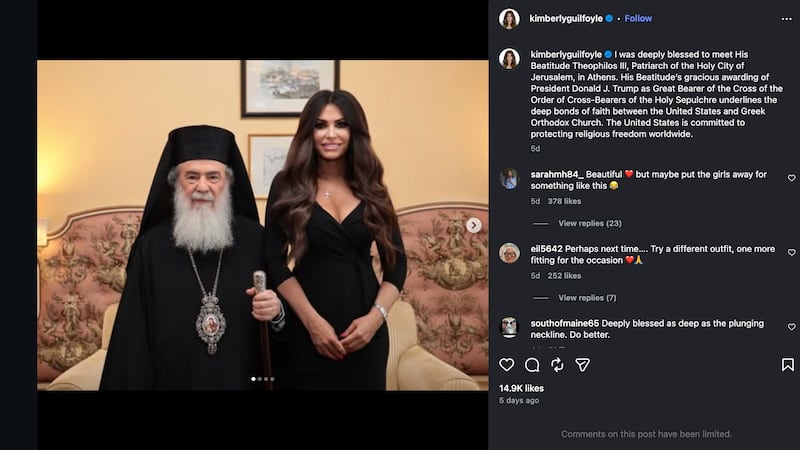 Kimberly Guilfoyle poses beside a Greek cleric in a form-fitting, low-cut black dress.