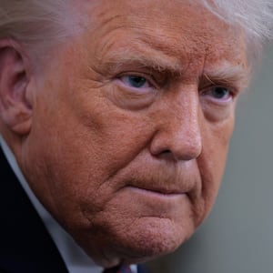 IN FLIGHT - JANUARY 22: U.S. President Donald Trump speaks to reporters on board Air Force One while flying in between Ireland and Washington as he returns from the World Economic Forum on January 22, 2026. Following a meeting with NATO Secretary General Mark Rutte, Trump announced a deal with European leaders on the semi-autonomous Danish territory of Greenland during the annual meeting of political and business leaders in Davos. (Photo by Chip Somodevilla/Getty Images)