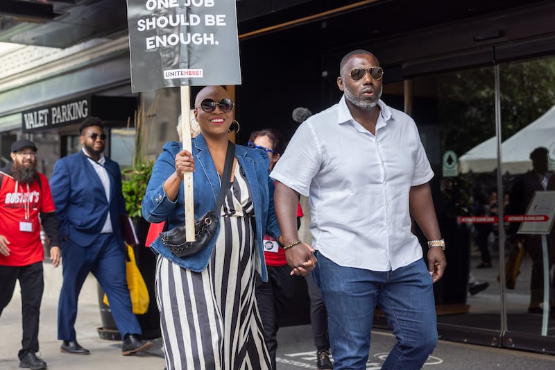 BOSTON, MASSACHUSETTS - SEPTEMBER 2: Rep. Ayanna Pressley (D-MA) and her husband Conan Harris join picketing hotel workers at the Boston Park Plaza Hotel on September 2, 2024 in Boston, Massachusetts. Thousands of hotel workers belonging to UNITE HERE are on strike after their union and some of the country's biggest hotel companies failed to come to an agreement in contract negotiations. (Photo by Scott Eisen/Getty Images)