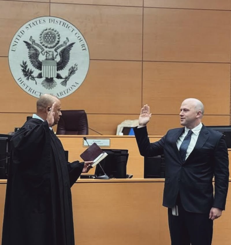 U.S. Attorney Timothy Courchaine being sworn in.