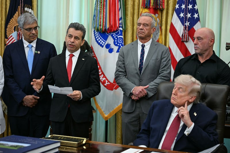 FDA Commissioner Marty Makary speaks as President Donald Trump sits at his desk in the Oval Office on April 18, 2026.