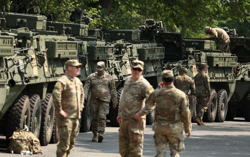 Soldiers tend to Stryker armored vehicles ahead of the upcoming U.S. Army 250th anniversary celebration parade in Washington, D.C., U.S., June 11, 2025. REUTERS/Kevin Lamarque