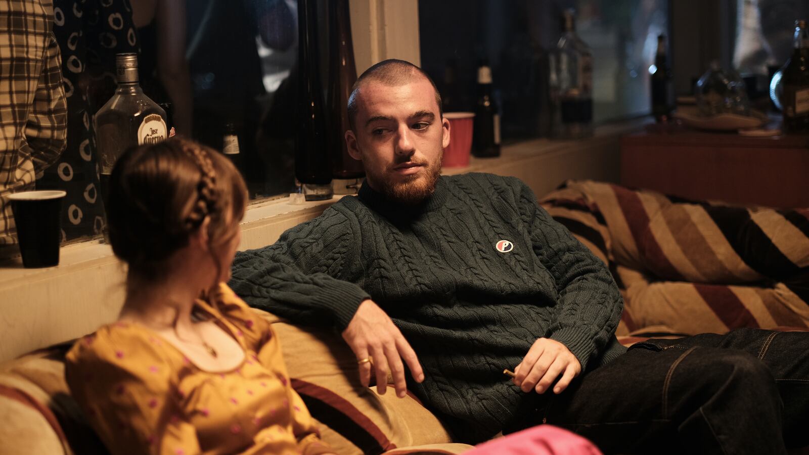 Maude Apatow and Angus Cloud sit together on Euphoria.