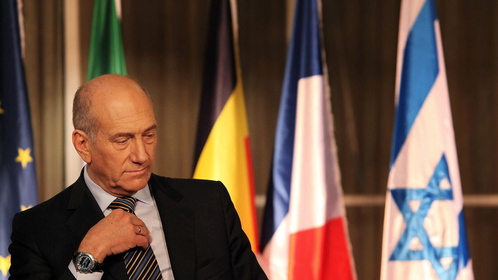 articles/2012/08/10/an-equal-opportunity-curse/olmert-flags-openz_x1meba