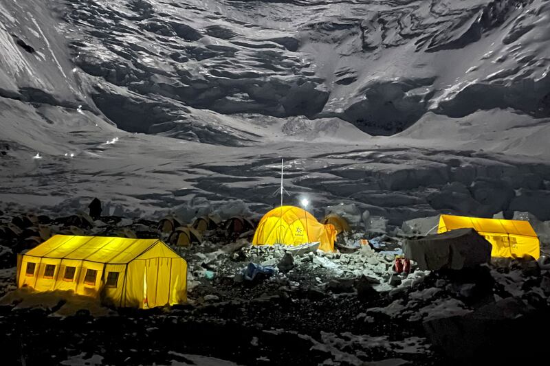 Mountaineers' tents lit up at night at Camp 2 of Mount Everest, in Nepal.