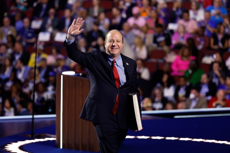 Colorado Gov. Jared Polis departs after speaking on stage during the third day of the Democratic National Convention at the United Center on August 21, 2024 in Chicago, Illinois.