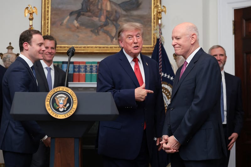 Trump speaks next to CEO of Intercontinental Exchange Jeffrey Sprecher in the Roosevelt Room during a cryptocurrency-related event.