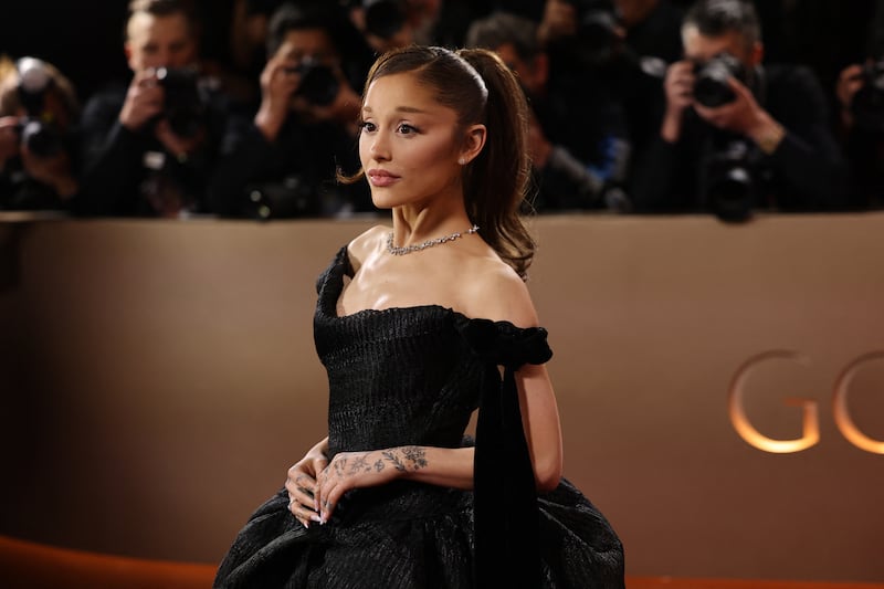 Ariana Grande poses on the red carpet at the 83rd Annual Golden Globes in Beverly Hills, California, U.S., January 11, 2026. REUTERS/Daniel Cole