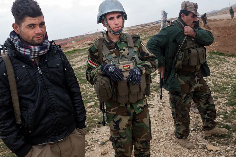 galleries/2015/03/19/uncovering-isis-s-mass-graves/150318-sayman-graves6_ybey3x