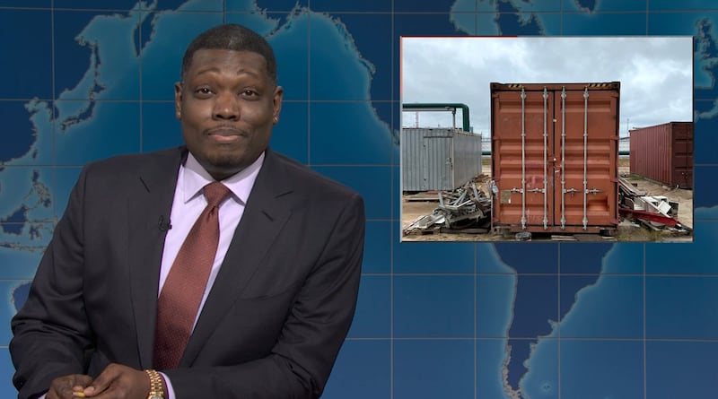 SNL, Michael Che with a picture of a shipping container.