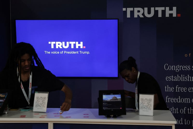 Workers straighten the Truth Social booth at the Great American State Fair celebrating the 250th anniversary of U.S. independence in Washington, D.C., U.S., July 2, 2026. REUTERS/Jonathan Ernst
