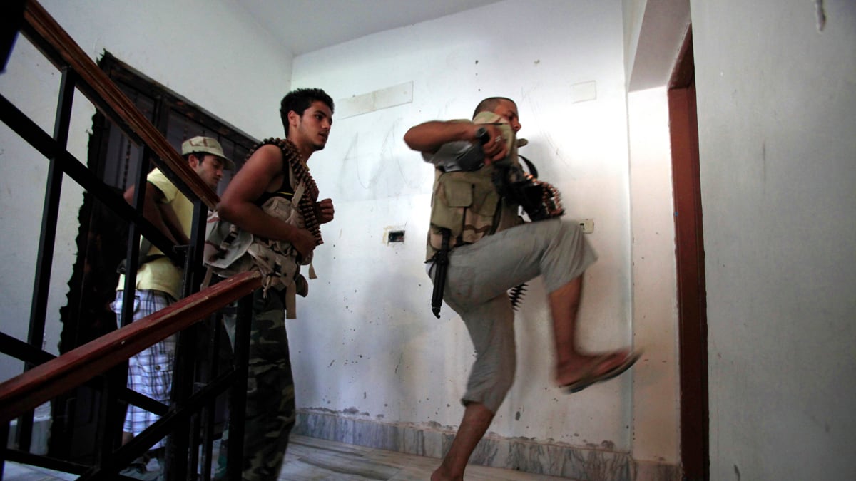 cheats/2011/08/25/rebels-gaddafi-is-surrounded/libya-rebels-gaddafi-surrounded-cheat_dpmnbv