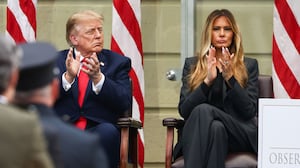 Donald Trump and first lady Melania Trump clap during a ceremony commemorating the 25th anniversary of the September 11th terrorist attacks in the courtyard of the Pentagon on September 11, 2026 in Arlington, Virginia.