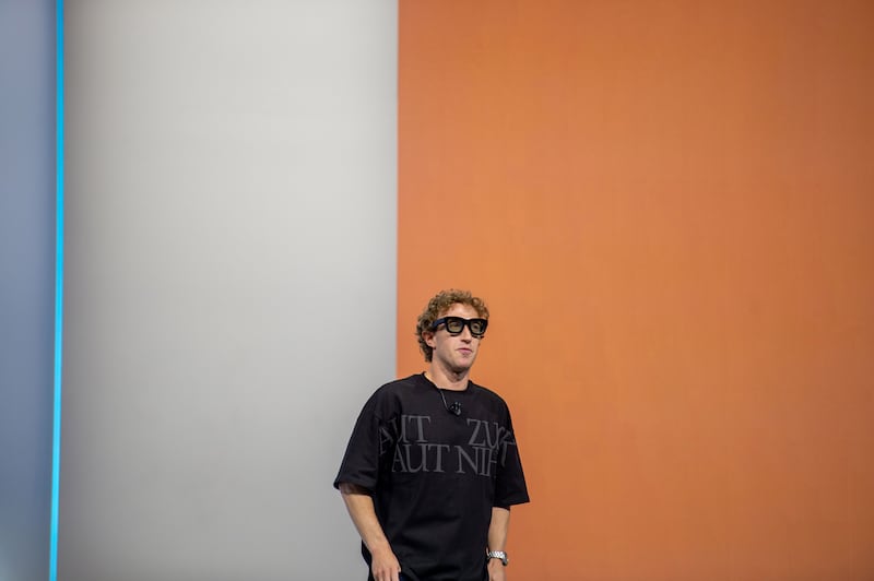 25 September 2024, USA, Menlo Park: At the Meta Connect developer conference, Mark Zuckerberg, head of the Facebook group Meta, shows the prototype of computer glasses that can display digital objects in transparent lenses. Photo: Andrej Sokolow/dpa