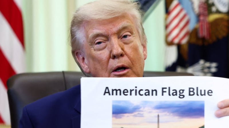 U.S. President Donald Trump holds a reflecting pool image at the Oval Office of the White House, in Washington, D.C., June 3, 2026.