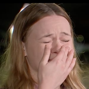 Carissa Davis fights back tears in a local news interview.