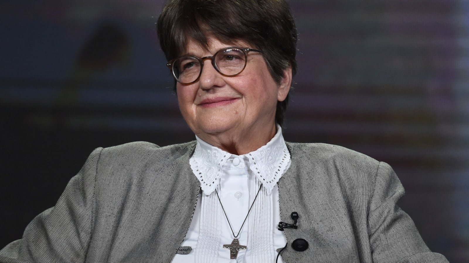 Sister Helen Prejean sitting on a stage.