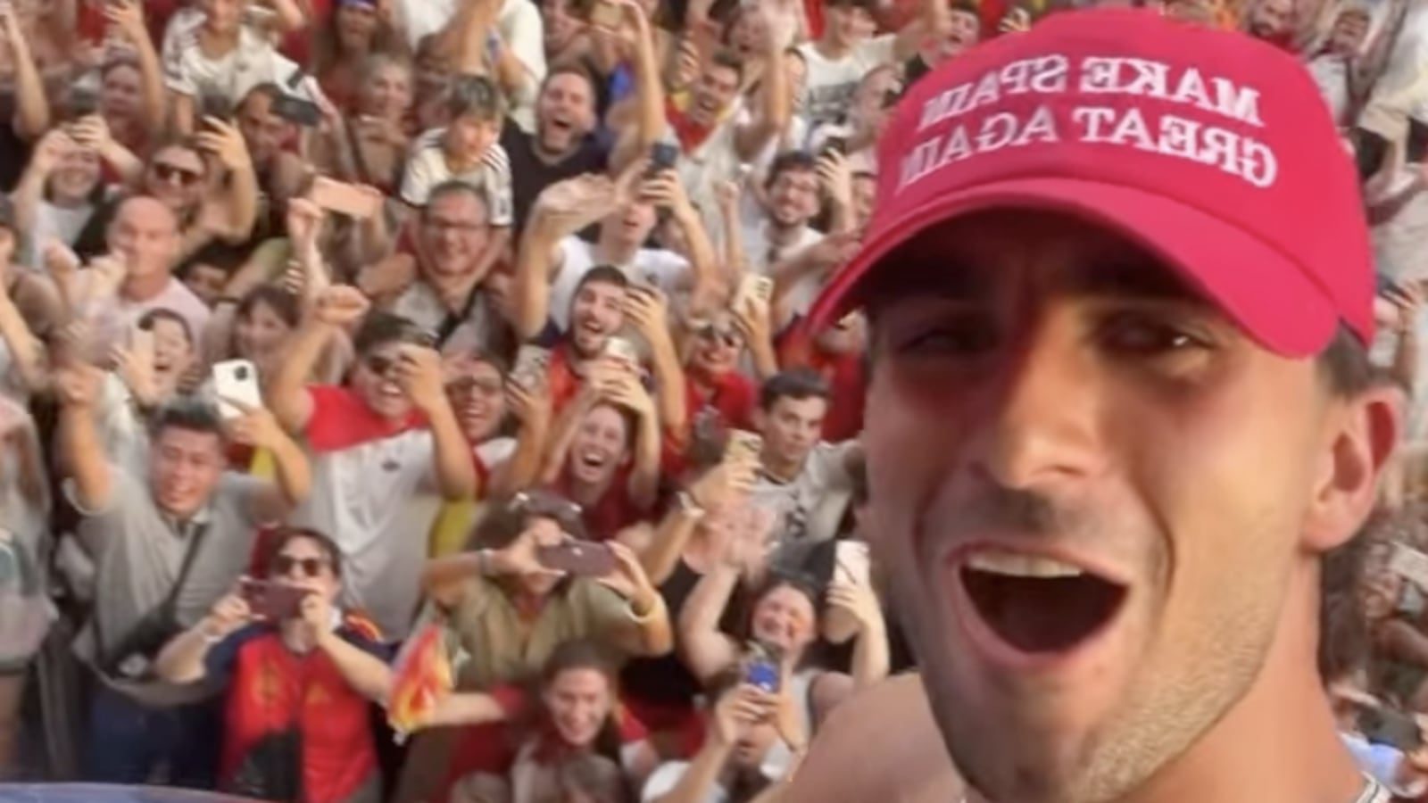 Ferran Torres wears 'Make Spain Great Again' hat in celebratory parade on Monday following World Cup win.