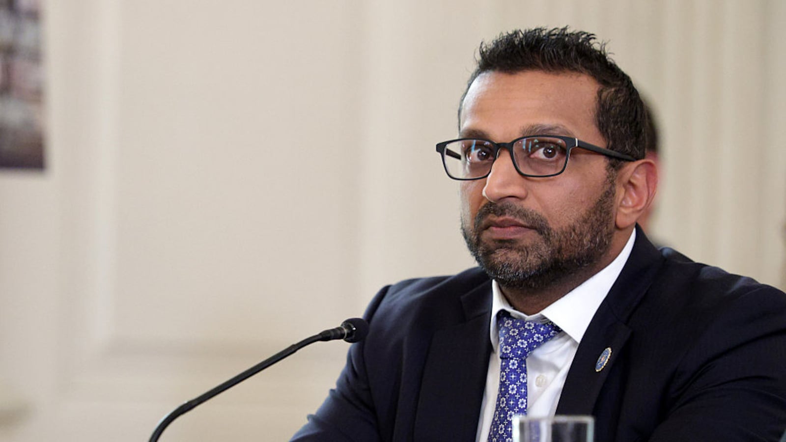 Director of the Federal Bureau of Investigation (FBI) Kash Patel listens as U.S. President Donald Trump delivers an announcement on his Homeland Security Task Force in the State Dining Room of the White House on October 23, 2025 in Washington, DC.